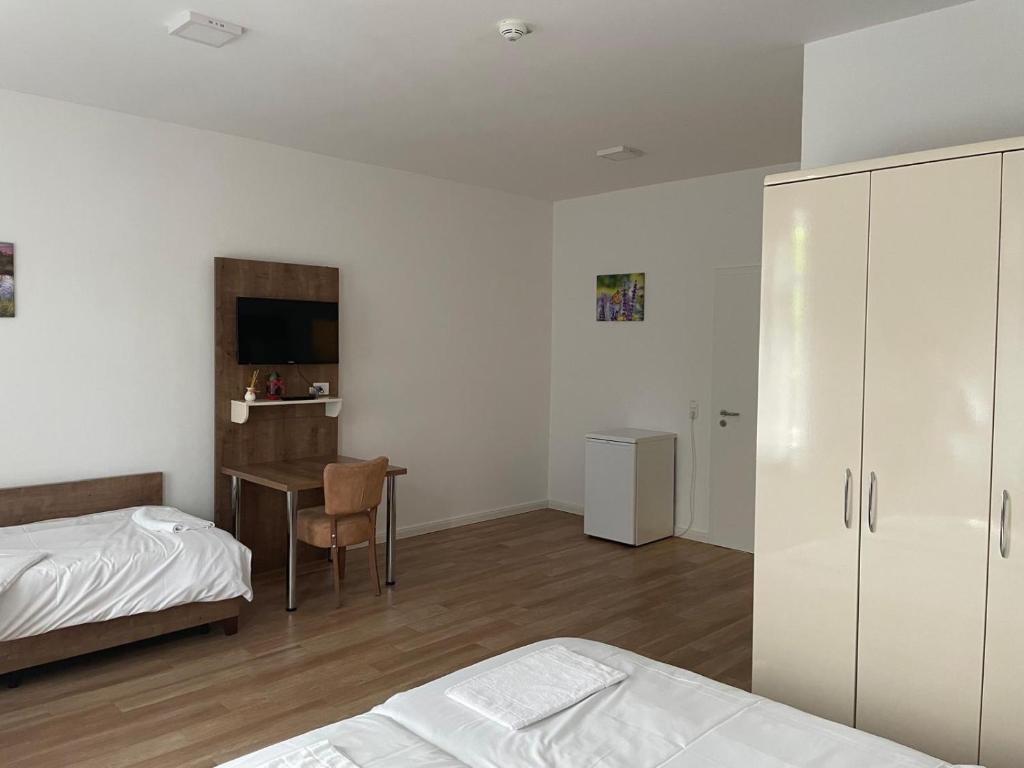 Postel nebo postele na pokoji v ubytování Hotel Oniro