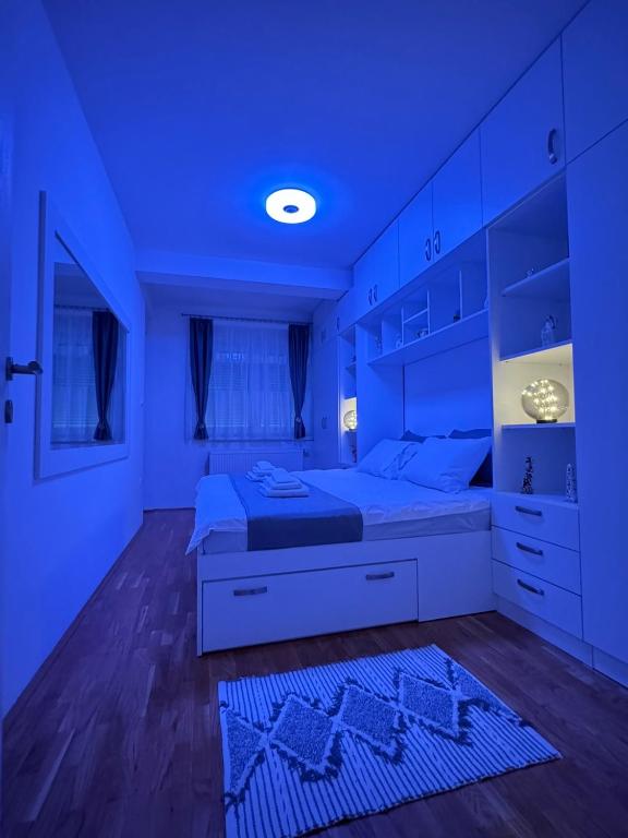 Postel nebo postele na pokoji v ubytování Bulevar Residence