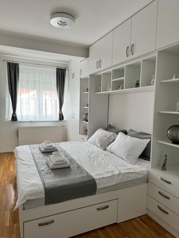 Postel nebo postele na pokoji v ubytování Bulevar Residence