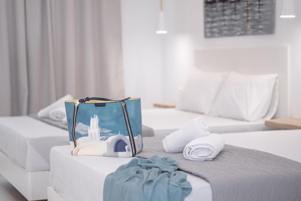Postel nebo postele na pokoji v ubytování Evriali Seaside Rooms