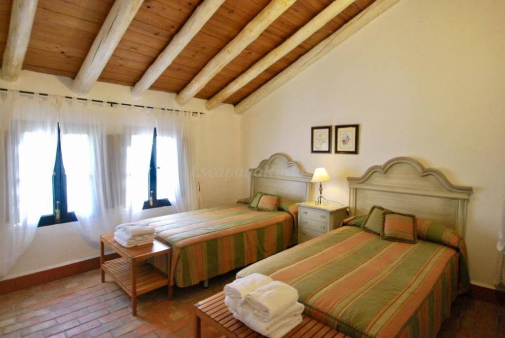 Posteľ alebo postele v izbe v ubytovaní Finca La Vicaria AGUADULCE