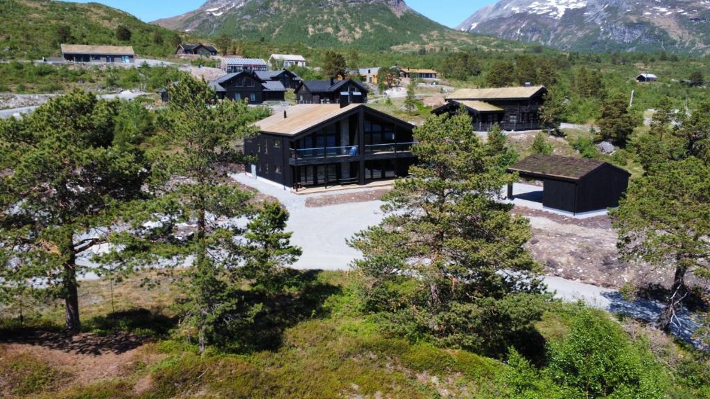an aerial view of a house in the mountains at Ladebua in Brunstad