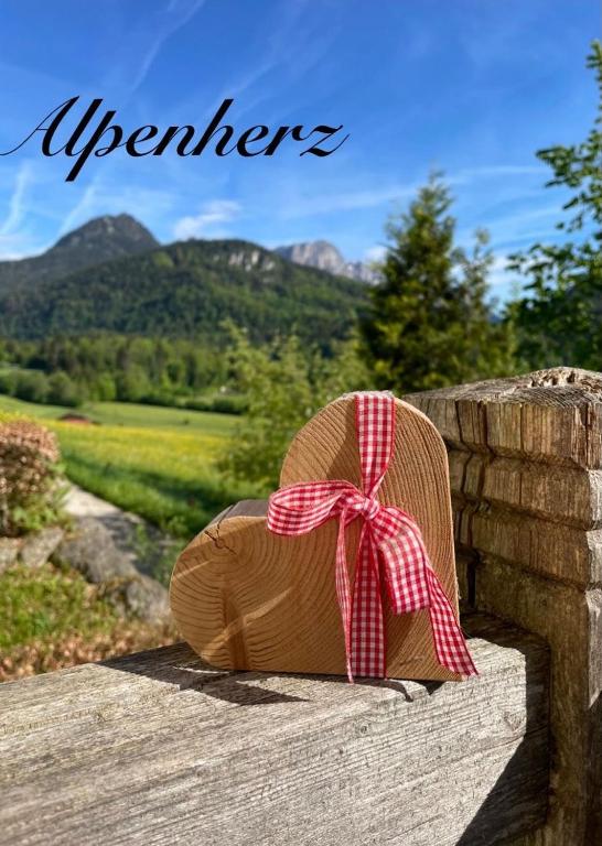 a chair with a bow sitting on a wall at Ferienwohnung Alpenherz Berchtesgaden in Berchtesgaden