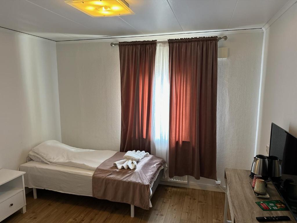 Postel nebo postele na pokoji v ubytování Hotell Lamar