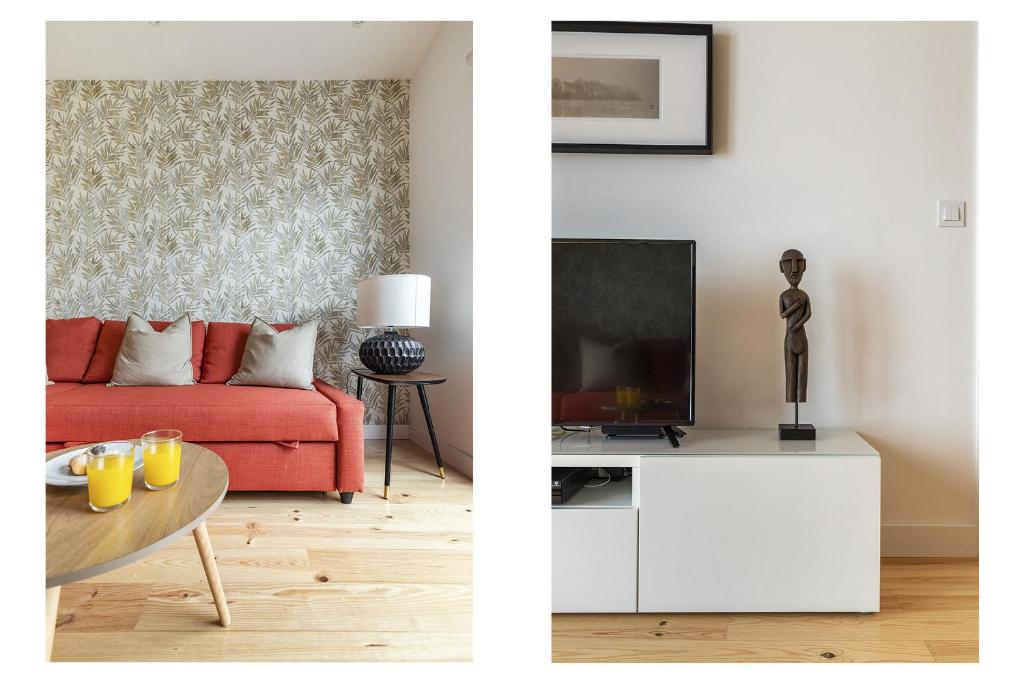 sala de estar con sofá rojo y TV en Belém Design Apartments by Homing en Lisboa