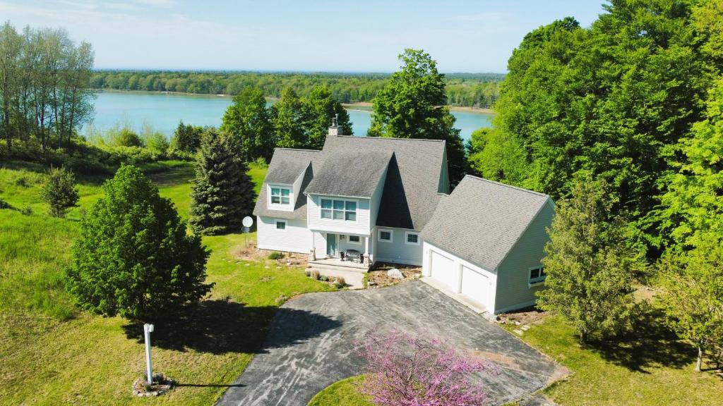an aerial view of a house with a lake at Sandhill House - Spectacular Lake Home With Toys! in Beulah