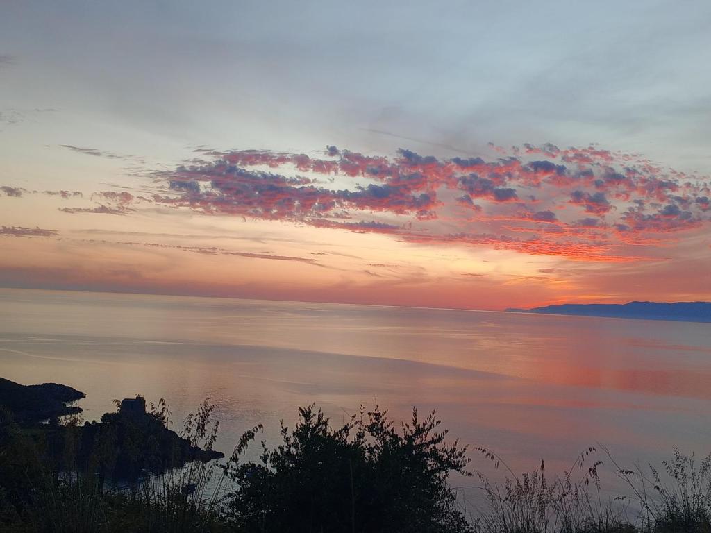a sunset over a body of water at Hotel Villa Principe in San Nicola Arcella