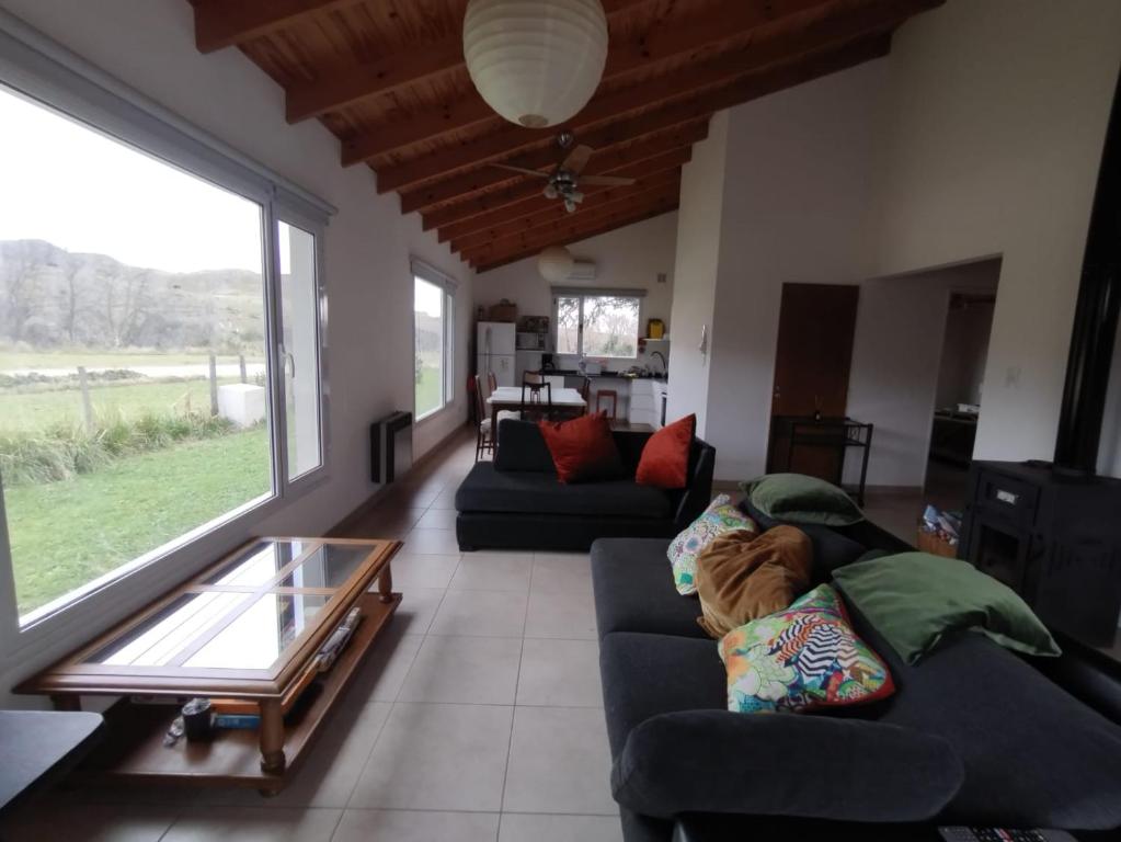 a living room with two couches and a coffee table at Maika in Sierra de la Ventana