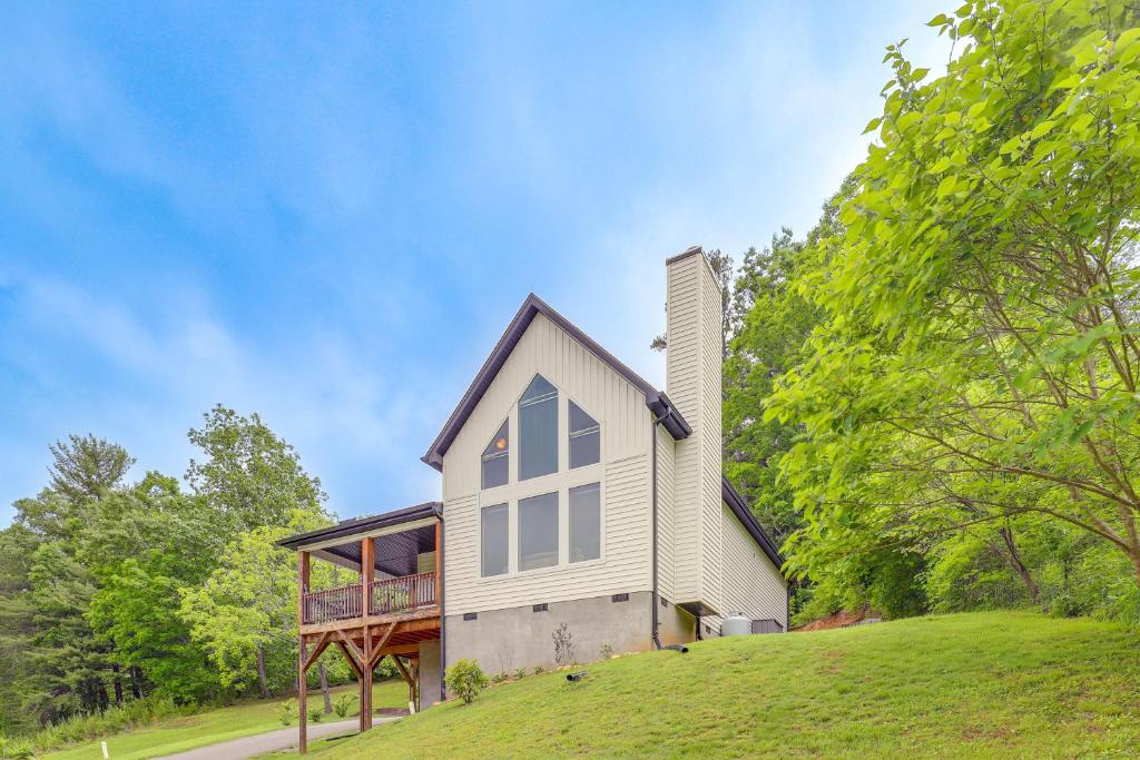 a house on top of a hill with trees at Family Home with Views about 5 Mi to Downtown Asheville! in Asheville