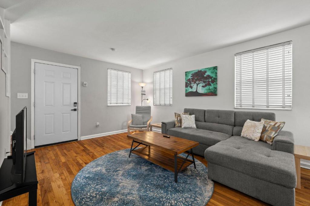 a living room with a couch and a table at 1 Bedroom Unit in Hyde Park House in Tampa