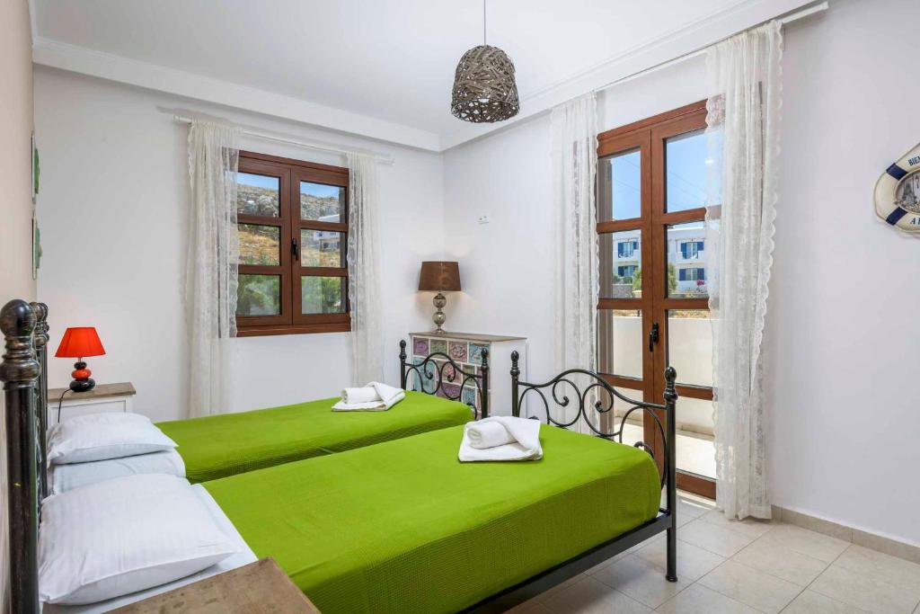 A bed or beds in a room at Lindos Emerald
