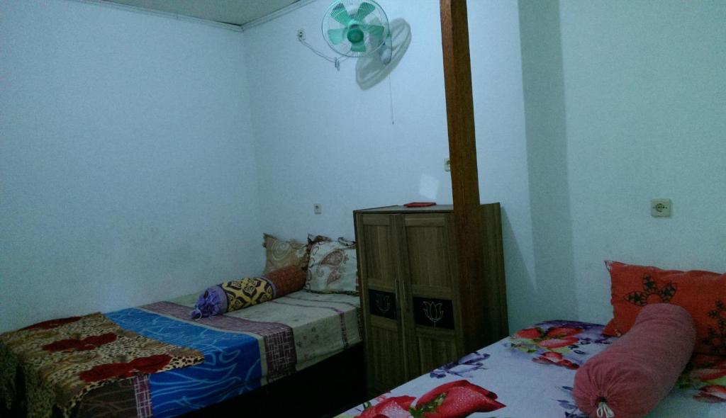 Postel nebo postele na pokoji v ubytování Diyah Homestay