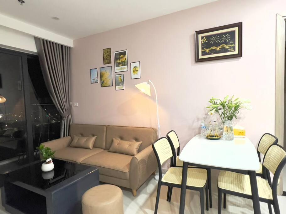 a living room with a couch and a table at Beer Homestay Huế 1 in Thôn Văn Dương