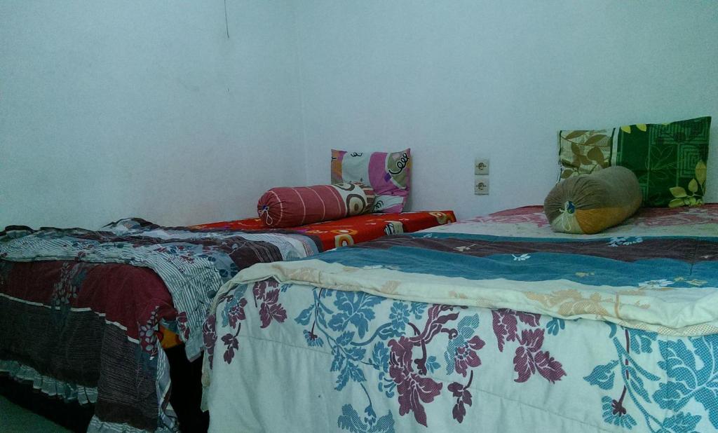 Postel nebo postele na pokoji v ubytování Diyah Homestay