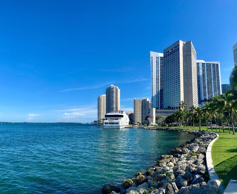 a city skyline with a body of water and buildings at InterContinental Miami, an IHG Hotel in Miami