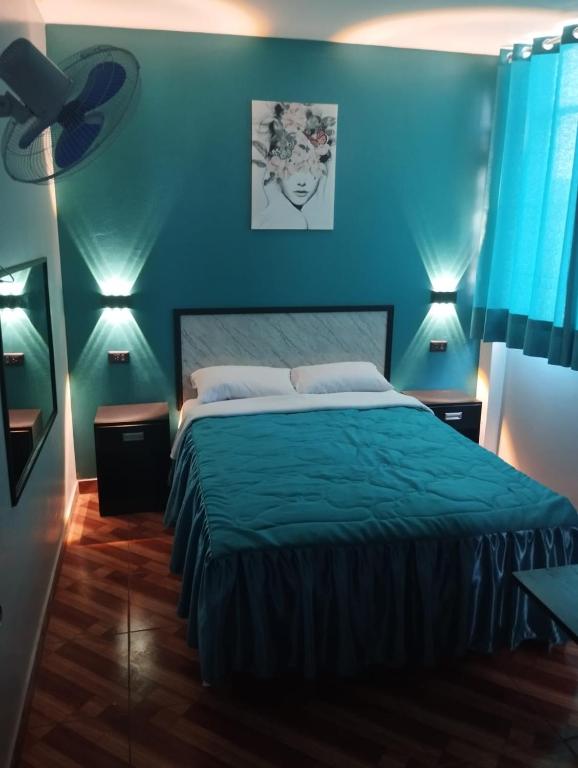 Postel nebo postele na pokoji v ubytování Hostal El Pilar