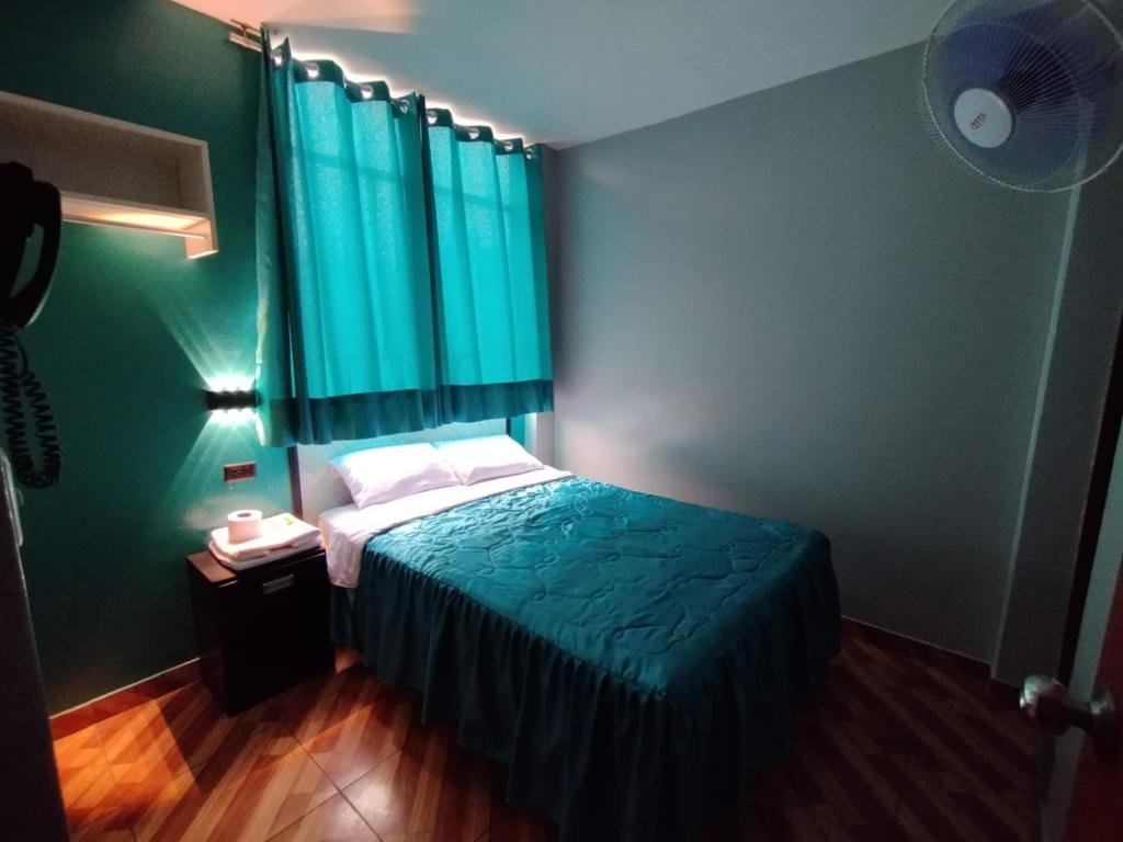 Postel nebo postele na pokoji v ubytování Hostal El Pilar