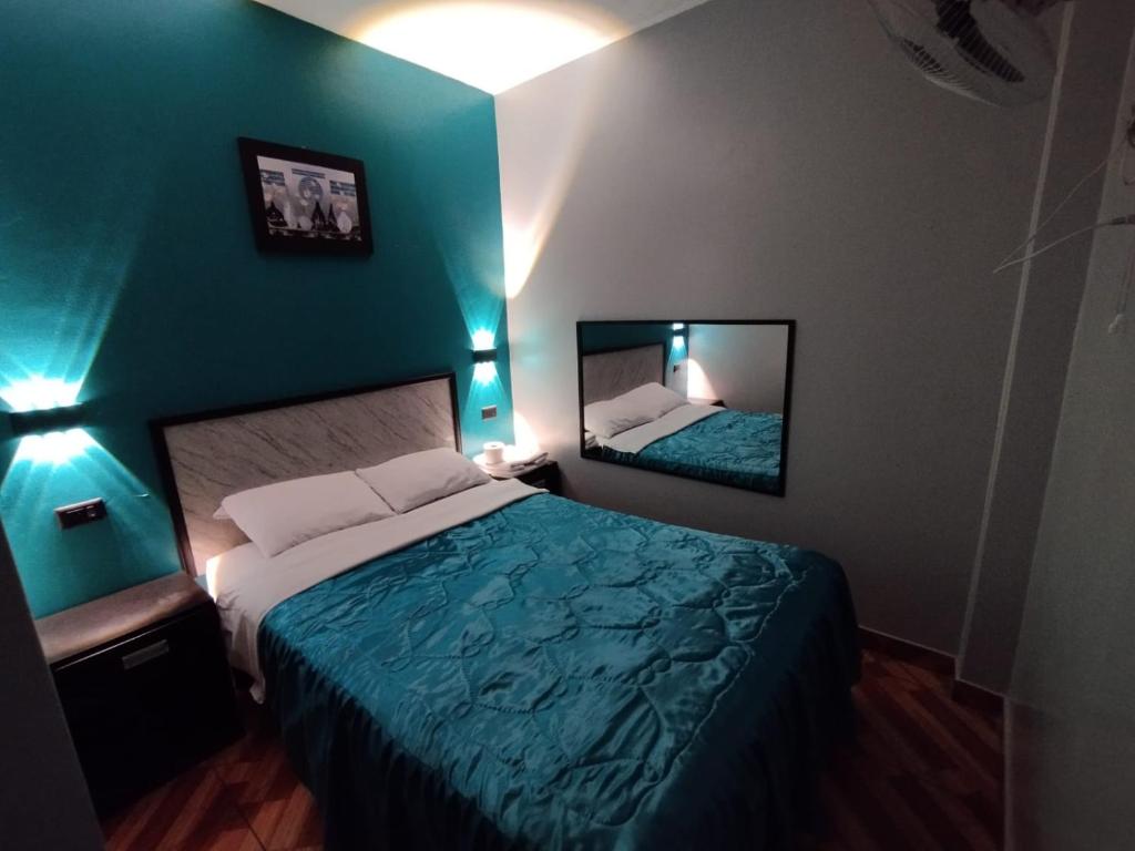 Postel nebo postele na pokoji v ubytování Hostal El Pilar