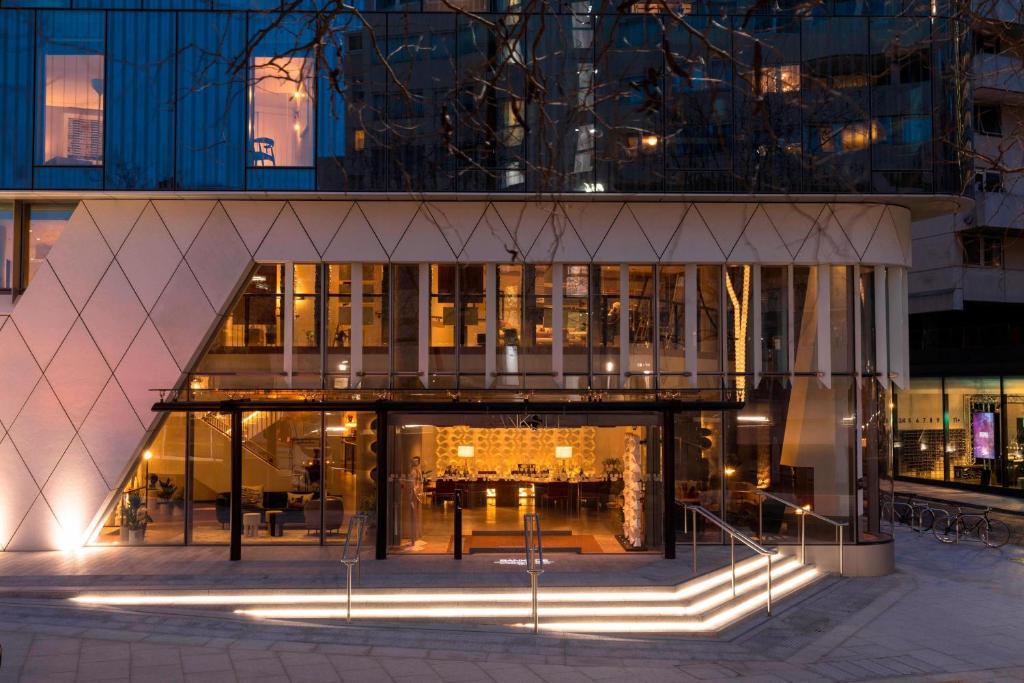 a large building with lights in front of it at Bankside Hotel, Autograph Collection in London