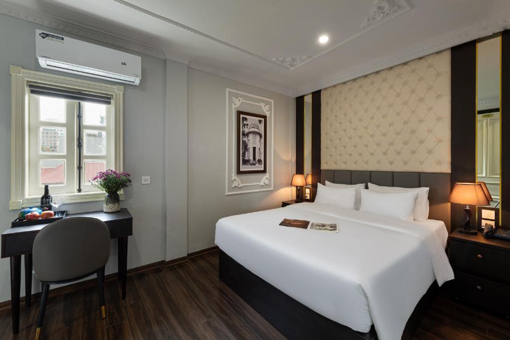 Postel nebo postele na pokoji v ubytování Avani Central Hanoi Hotel