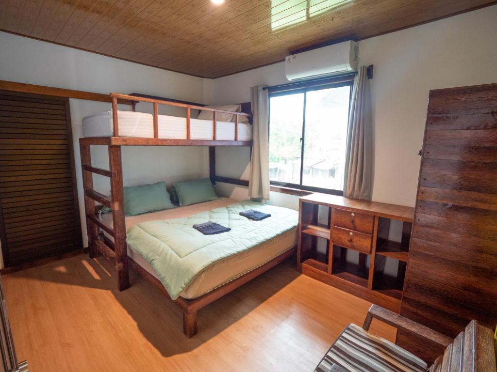 Postel nebo postele na pokoji v ubytování Jamburae Lodge