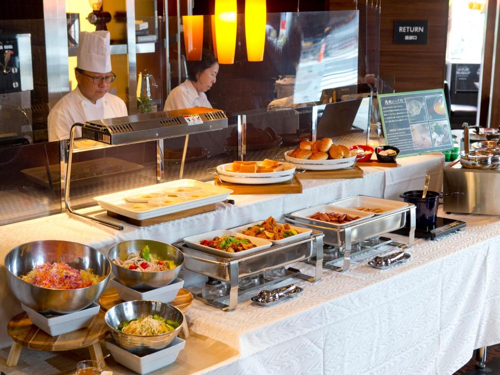 a buffet line with many different types of food at Hotel Hillarys in Osaka