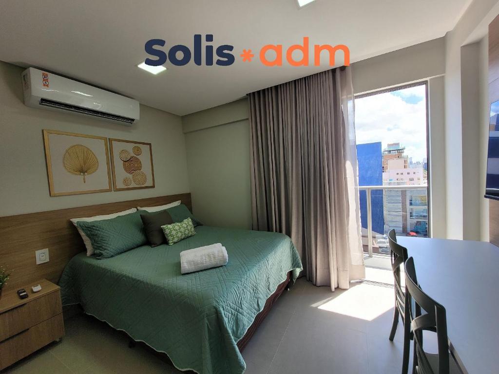 a hotel room with a bed and a window at Way Bossa in Tambaú