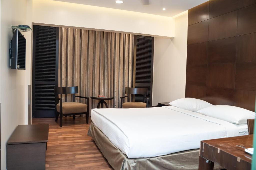 Postel nebo postele na pokoji v ubytování Shantai Hotel