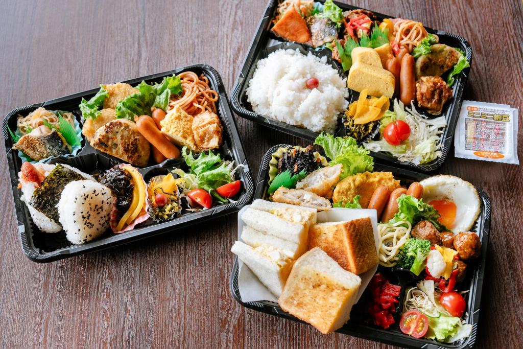 three plastic containers filled with different types of food at Hotel Hillarys in Osaka