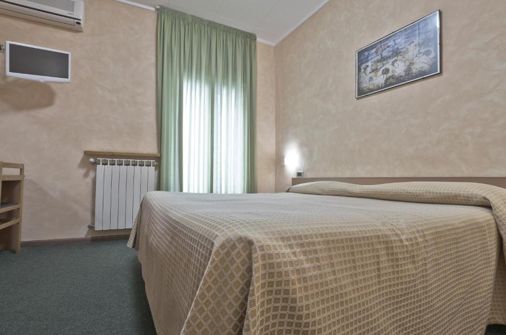 Postel nebo postele na pokoji v ubytování Hotel Valentini Inn