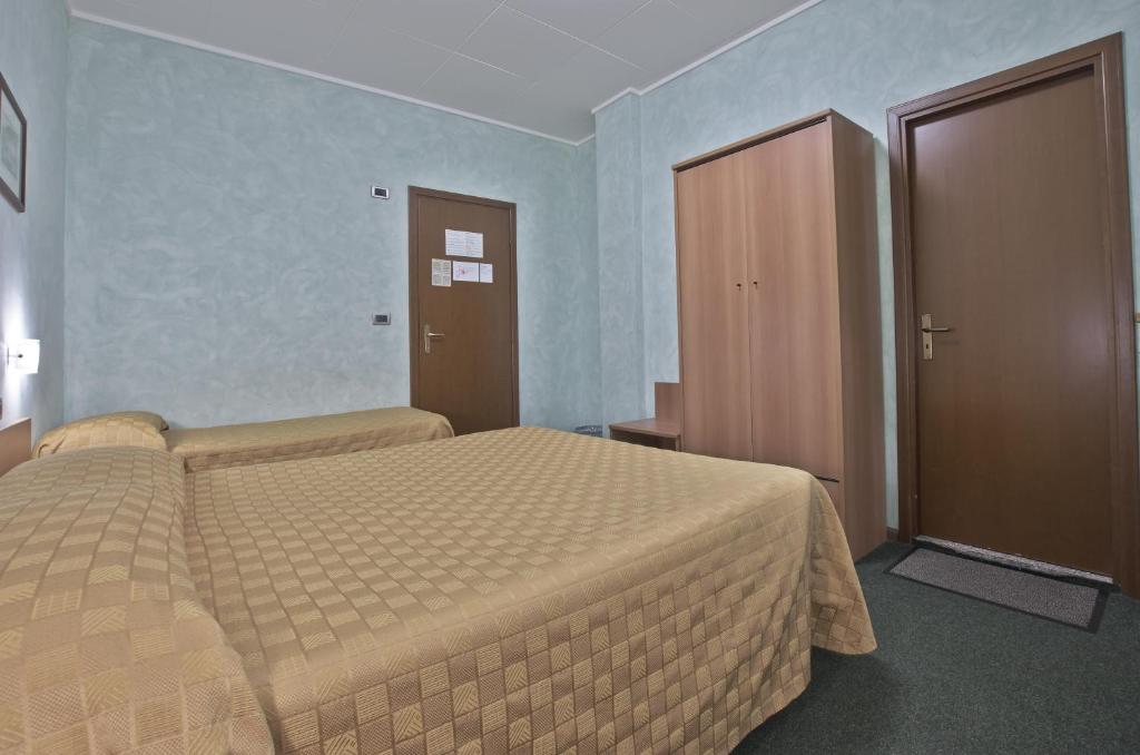 Postel nebo postele na pokoji v ubytování Hotel Valentini Inn