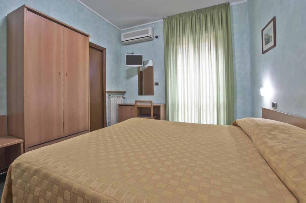 Postel nebo postele na pokoji v ubytování Hotel Valentini Inn