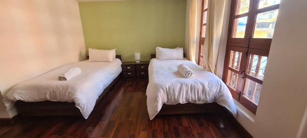Postel nebo postele na pokoji v ubytování Dalucha Heritage Home