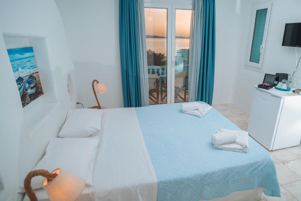 Postel nebo postele na pokoji v ubytování Sofia's Bungalows Mykonos