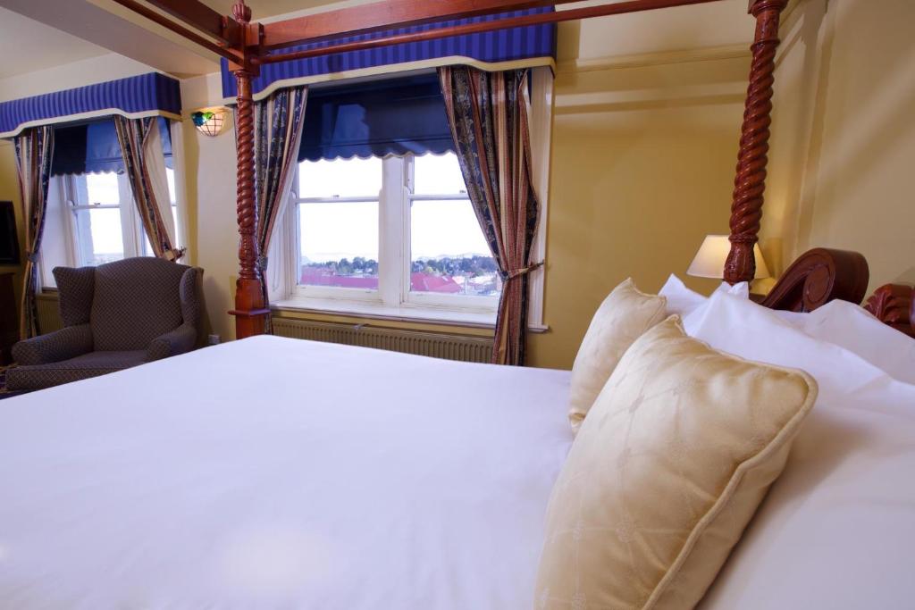 Postel nebo postele na pokoji v ubytování Carrington Hotel