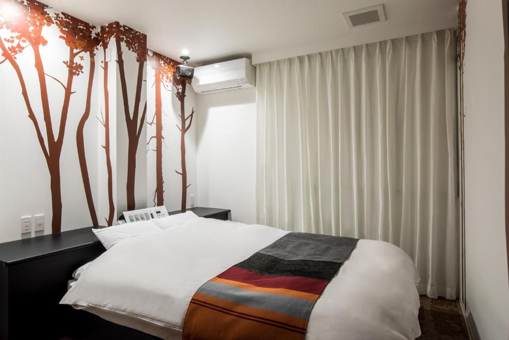 Postel nebo postele na pokoji v ubytování HOTEL MONO - Adult only