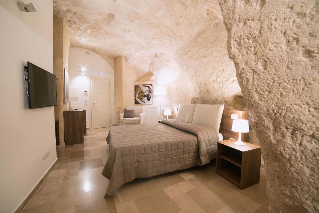 Postel nebo postele na pokoji v ubytování Albergo Del Sedile