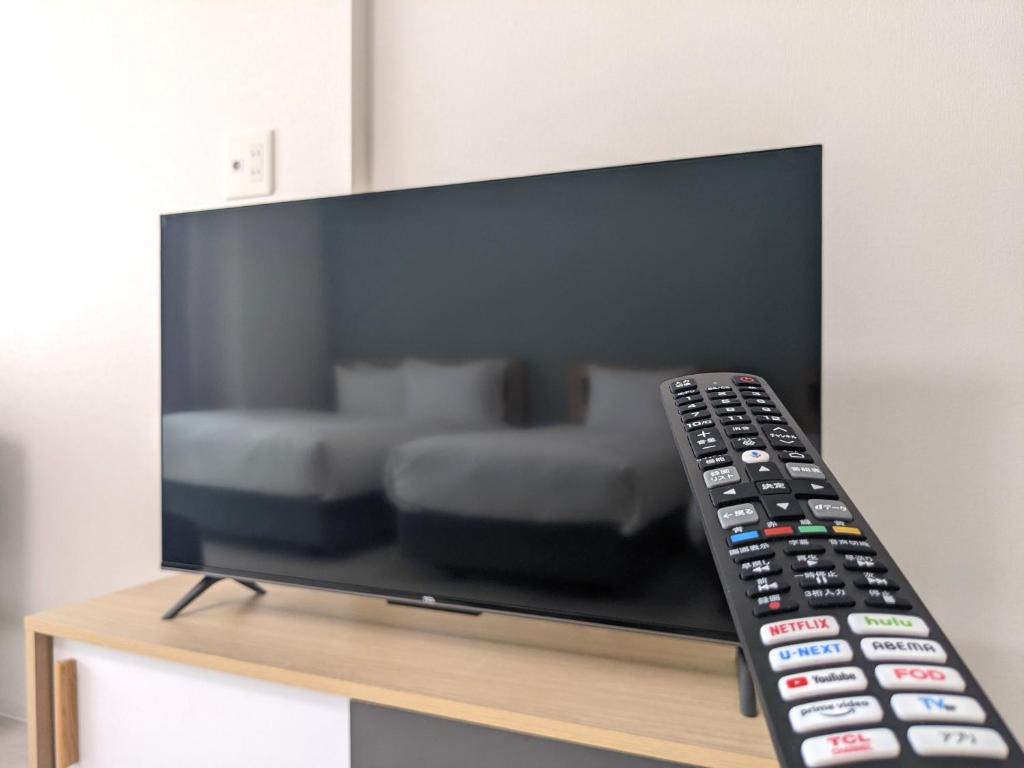 TV a/nebo společenská místnost v ubytování ESLEAD HOTEL Osaka Tsuruhashi