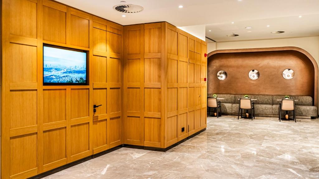 a conference room with chairs and a flat screen tv at Lamartine Hotel in Istanbul