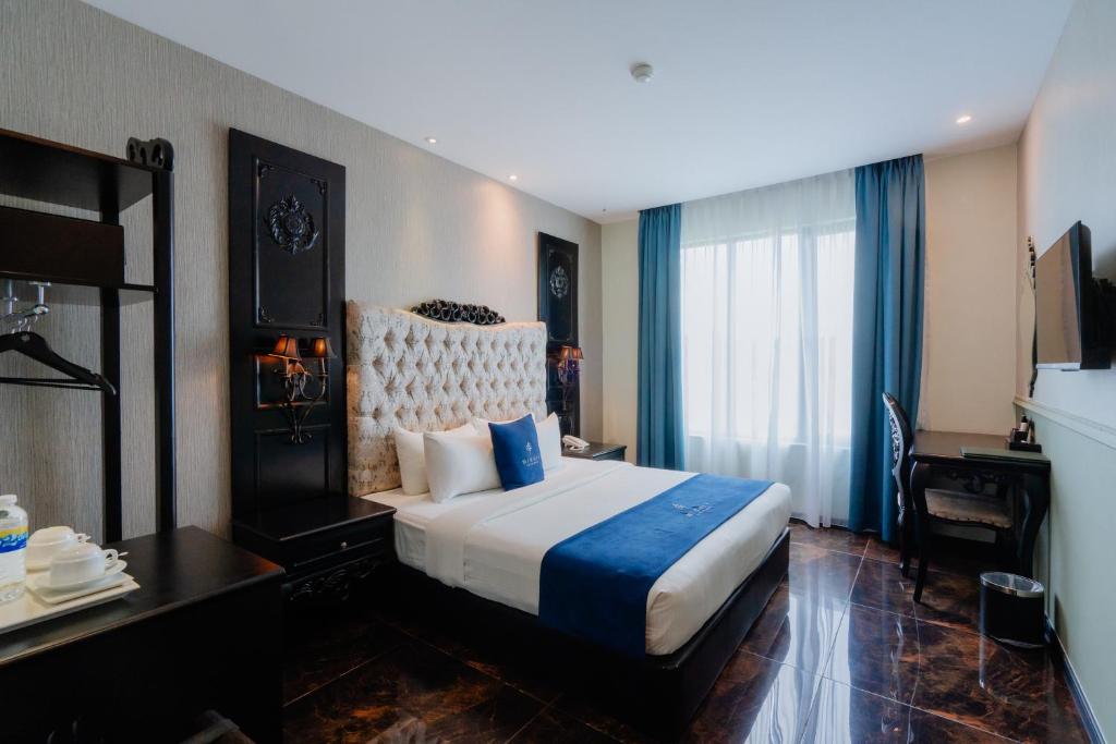 Postel nebo postele na pokoji v ubytování Midori Concept Hotel