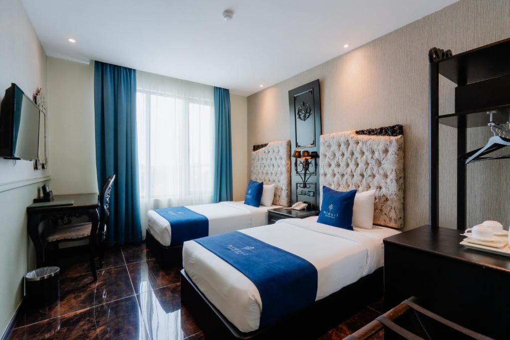 Postel nebo postele na pokoji v ubytování Midori Concept Hotel