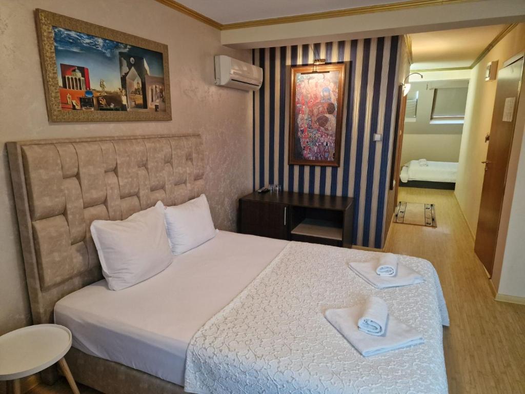 Postel nebo postele na pokoji v ubytování Hotel Gabi