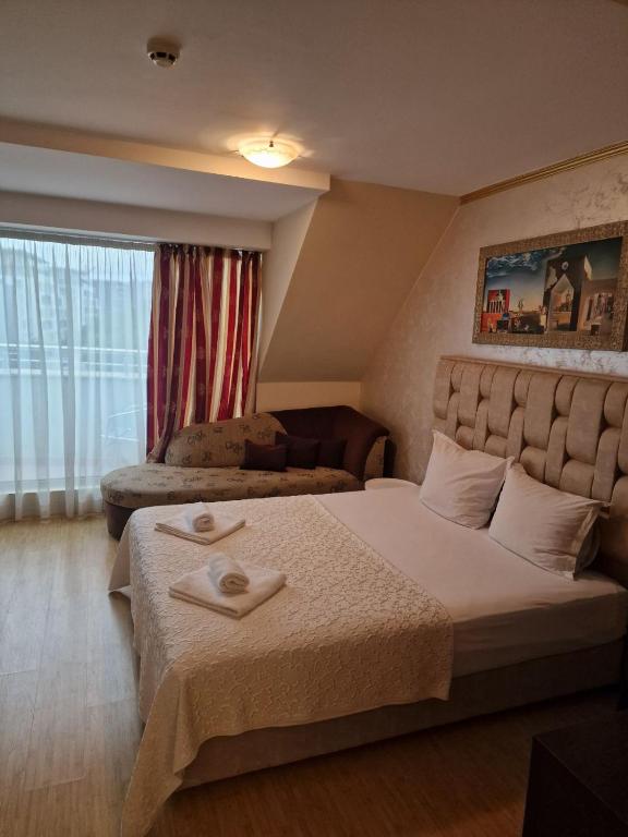 Postel nebo postele na pokoji v ubytování Hotel Gabi