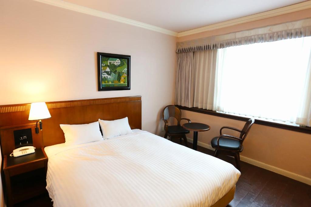 Postel nebo postele na pokoji v ubytování Hotel Castle Inn Tsu