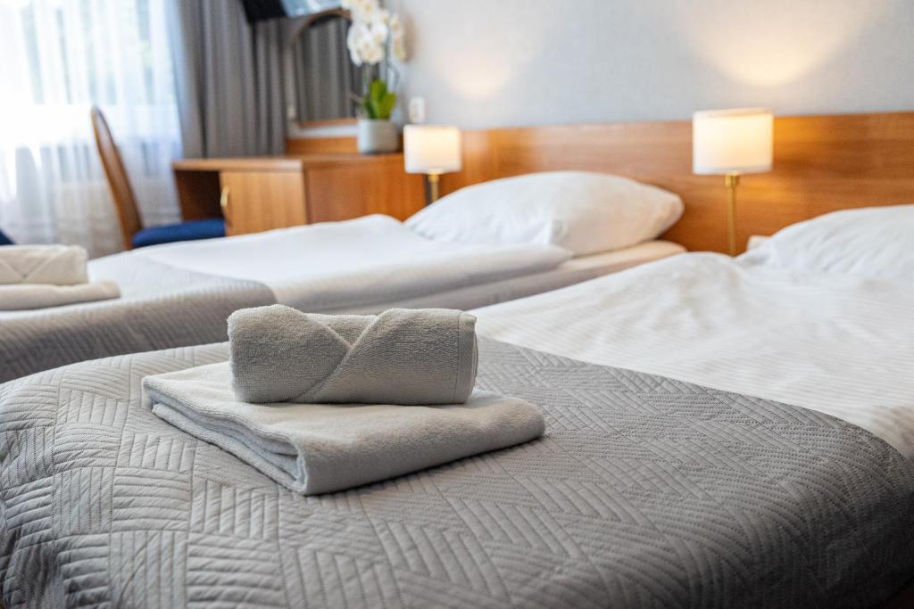 Łóżko lub łóżka w pokoju w obiekcie Baltic Inn