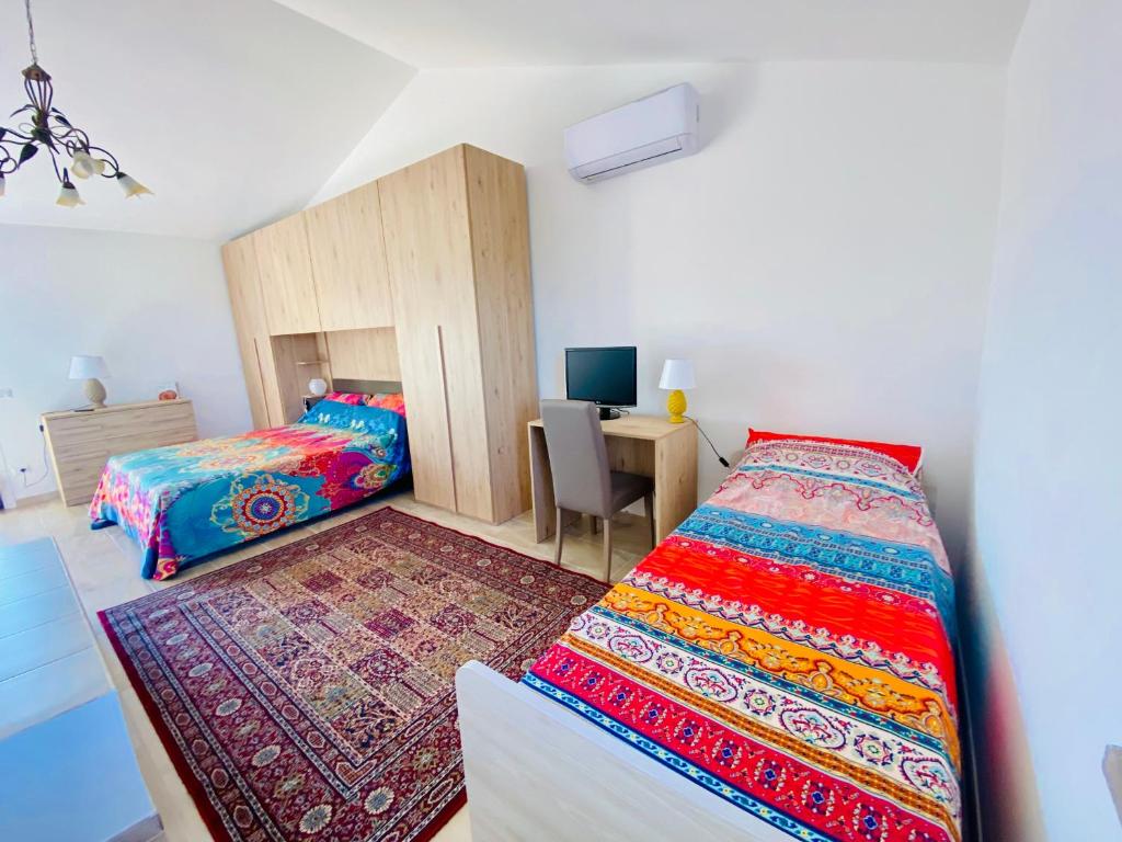 Postel nebo postele na pokoji v ubytování Way2Rome Apartments