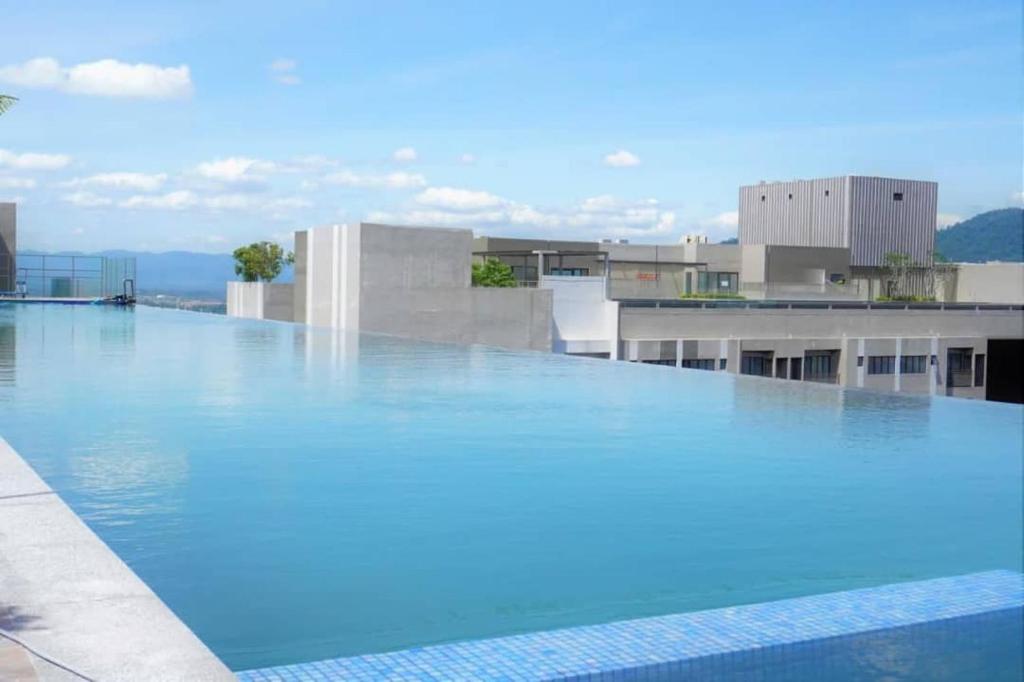 a large swimming pool on top of a building at Youth City@Nilai in Nilai
