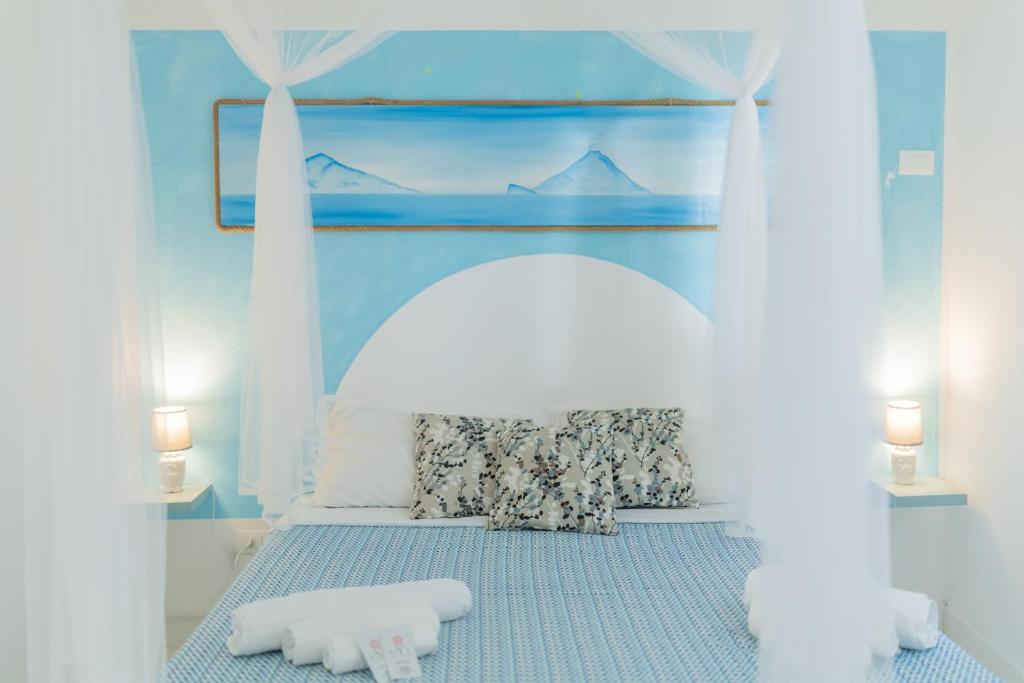 Ένα ή περισσότερα κρεβάτια σε δωμάτιο στο Holiday Eolie Village