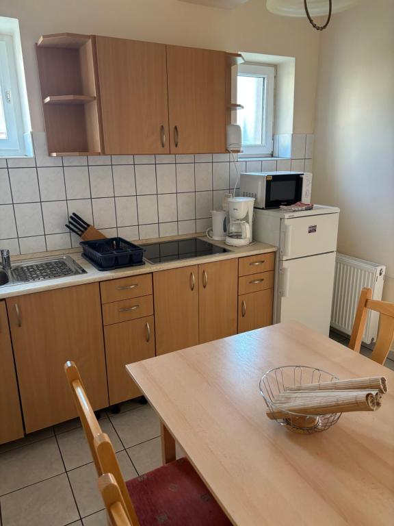 Kuchyň nebo kuchyňský kout v ubytování Afamado apartman Fisli