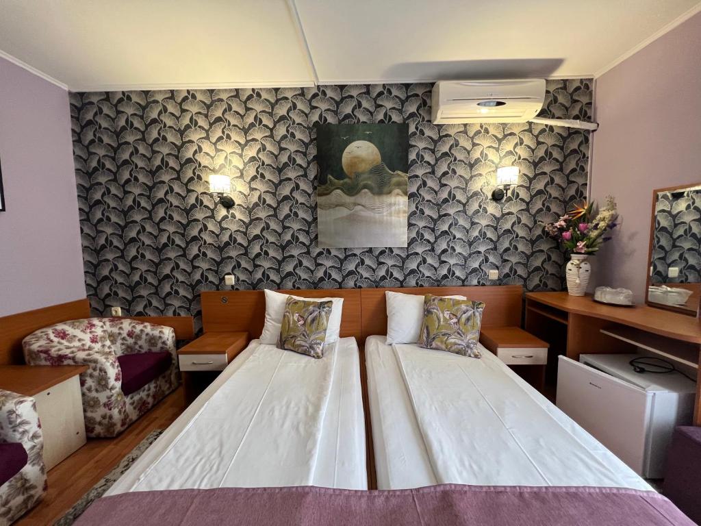 Postel nebo postele na pokoji v ubytování Hotel Violeta